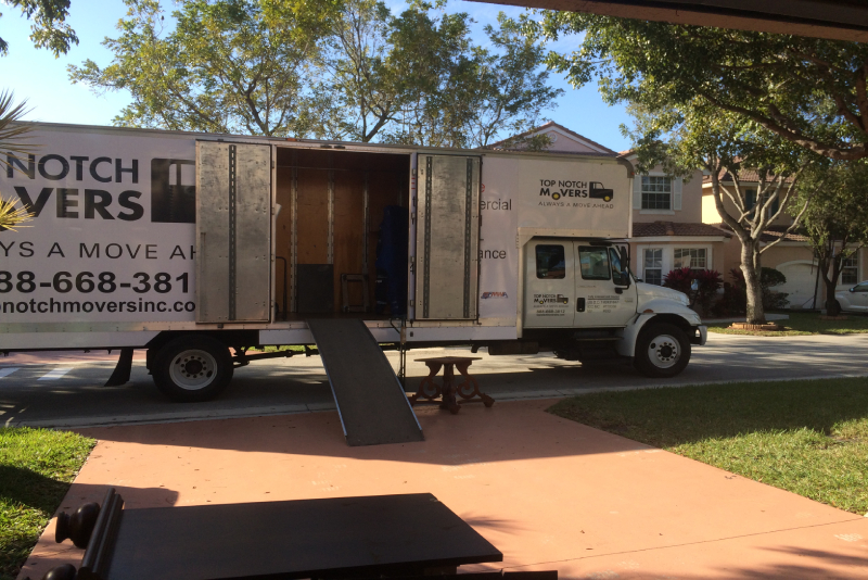 Local moving done by one of our Pembroke Pines crews with 28 ft truck parked by the entrance to the house
