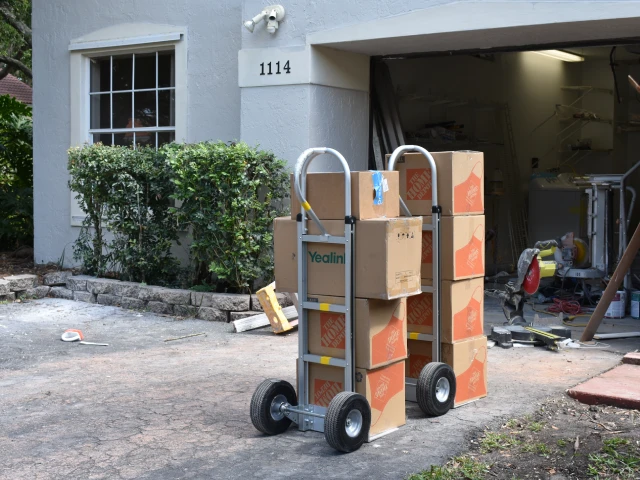 Two handtrucks and boxes on a local move